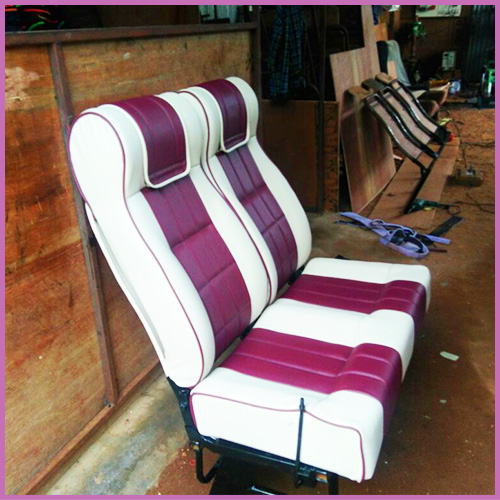 Maroon and cream push-back seat