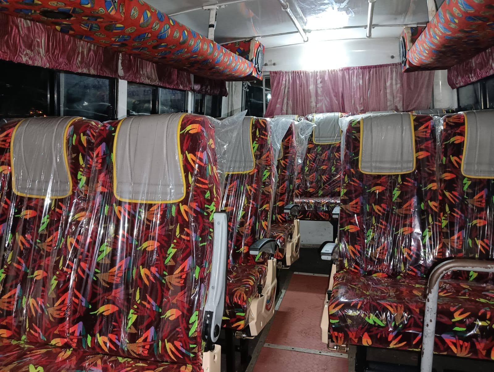 Full row of red floral patterned seats