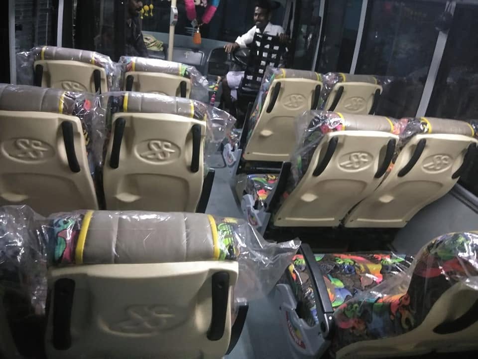 Row of cream seats showing the embossed SS logo