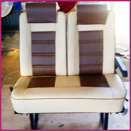 Brown and beige push-back seat